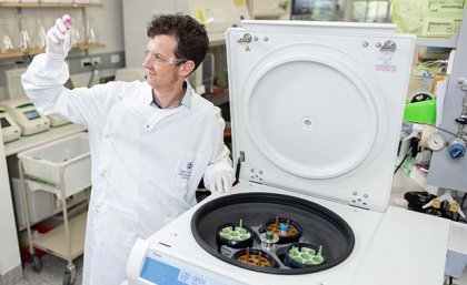 Professor Keith Chappell in the lab using a centrifuge